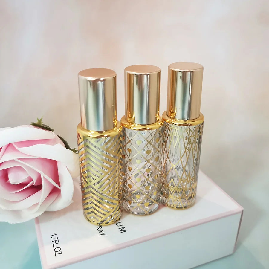 Wholesale 8ml Gold Stamping Patterned Essential Oil clear Roller Glass Bottle With Shiny Gold Cap