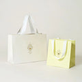 China Manufacturer White Luxury Printed Gift Paper Bag Custom Die Cut Design Retail Shopping Paper Bags With Your Own  Logo