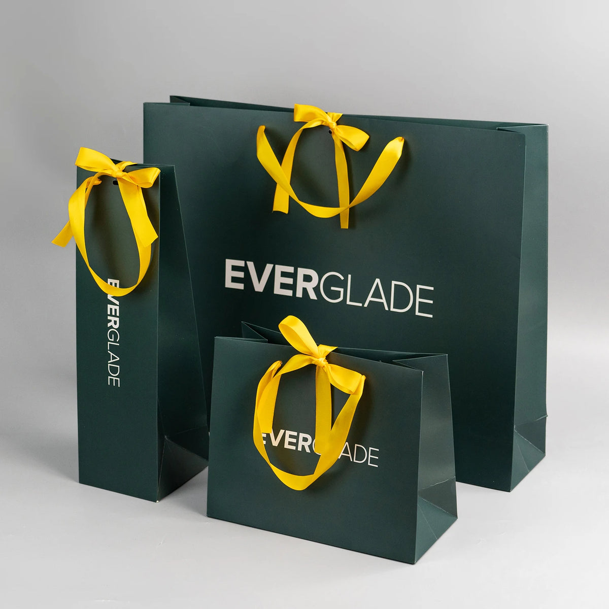 Wholesale Custom Emerald Green Printed Luxury Shopping Gift Paper Bag with Handle and Bow luxury Paper Bags with Your Own logo