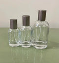 Hot Sales Custom Cosmetic Reusable Empty Perfume Refillable Glass Bottle 30ml Round Spray Pump Perfume Bottle