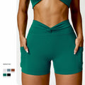 2024 Solid High Waist Yoga Shorts for Women with Phone Pockets Spandex/Nylon Material Twist Design Hip Lift Exercise Shorts