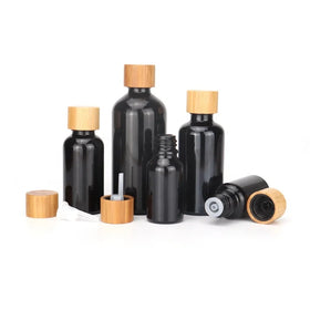 Essential Oil Bottle 10ml 15ml 30ml 50ml 100ml Empty Cosmetic Black Glass Bottle with Bamboo Cap Reducer for Body Massage Oil