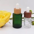 Flat Shoulder Green 30ml 100ml 1oz Eye Dropper Bottle 2oz Glass  with Dark Wooden Dropper Lid
