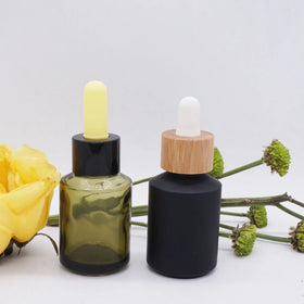 1oz 30ml 60ml 2oz Sloping Shoulder Olive Green Matt Black Oil Glass Bottle with Bamboo Collar Cap