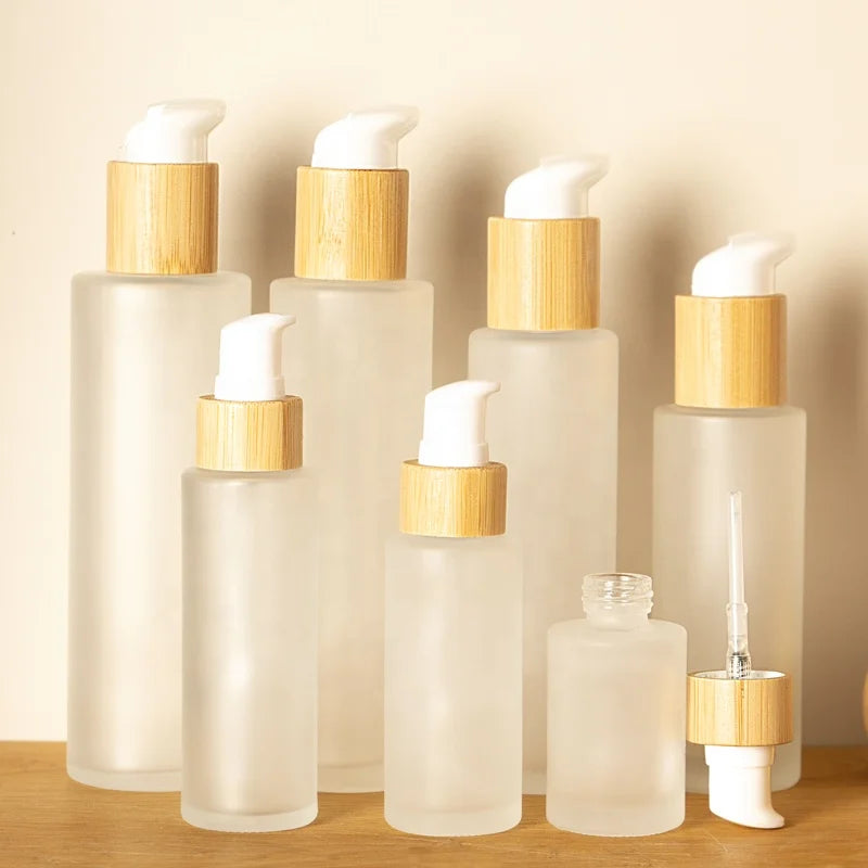 2025 New Design Frosted Glass Lotion Bottle 30ml/50ml Skin Care Serum & Facial Cleanser Container Bamboo Pump Head Pump Sprayer