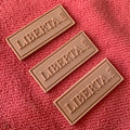 Company logo Single Color 3D Raised Silicone Rubber Labelsolid Color Soft Plastic Rubber Label With Stitching Lines