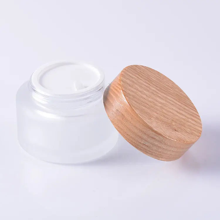China Supplier 50ml Clear Skincare Cream Glass Jar with Bamboo Lid for Cosmetics Storage