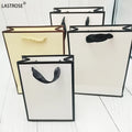 Factory Supplier Luxury Ribbon Handle White Card Board Paper Bags for Boutique Shopping Own Brand Promotion Use