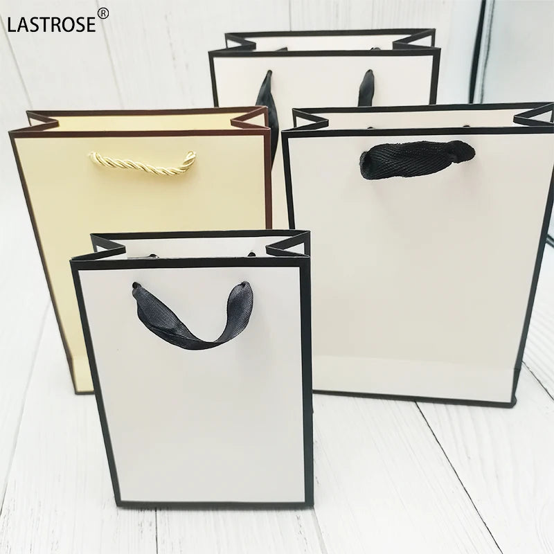 Factory Supplier Luxury Ribbon Handle White Card Board Paper Bags for Boutique Shopping Own Brand Promotion Use