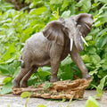 Lifelike Elephant Resin SculptureGray Elephant Statue with Detailed Skin Texture and Ivory Tusks Standing on Natural Rock Base