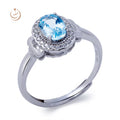 Blue Topaz Oval Cut Claw Set Rhodium Plated Sterling Silver Ring