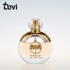 Devi Wholesale 100ml Luxury Hot Stamping Alloy Perfume Glass Bottle with Silver Cap and Carton Packing for Perfume