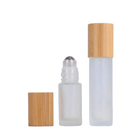 Wholesale 5ml 10ml Clear Frosted Essential Oil Glass Roll-on Bottle with Bamboo Lid and Metal Roller for Ball