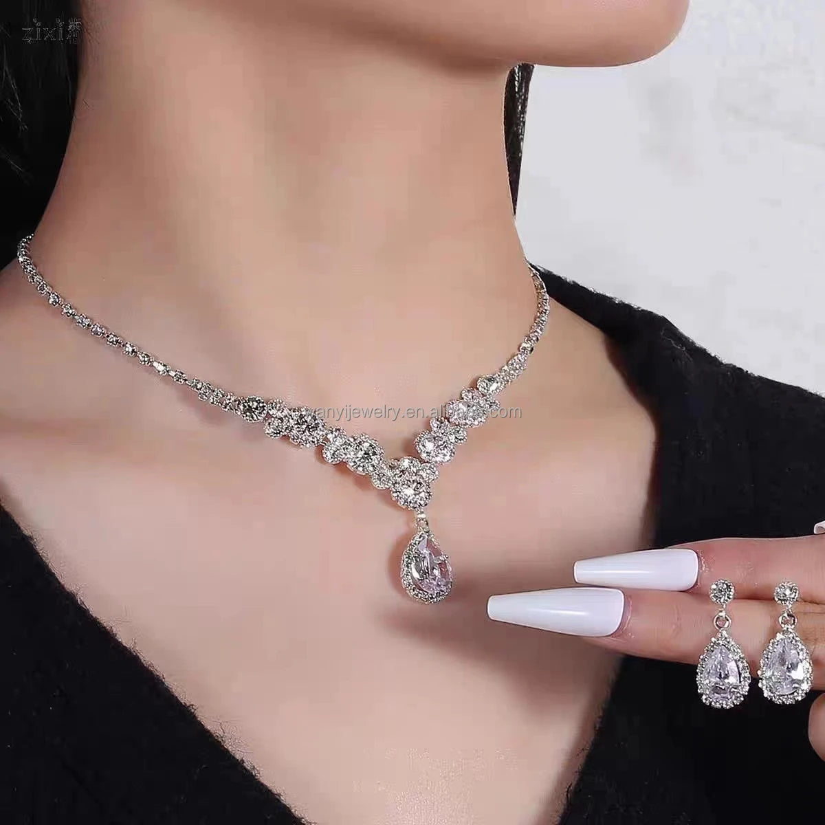 The Dress Is Accessorized with Teardrops of a Diamond Angel Necklace Earring Jewelry Set