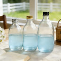 Clear 300ml 350ml 500ml Empty Round Glass Beverage Bottle for Energy Drinks with Metal Lid