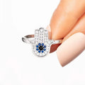 Huitan S925 Unique Palm Shaped Evil Eyes Design Full Simulate Moissanite Round Blue Zircon 925 Sterling Silver Rings for Women