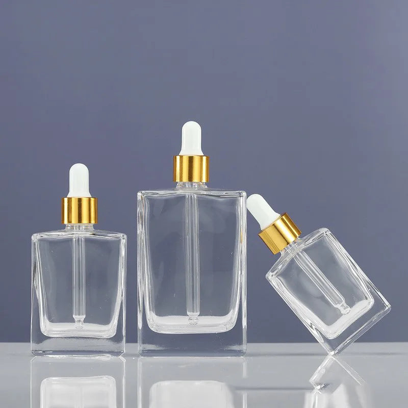 Clear Glass Oil Bottle with Dropper 30ml 50ml 100ml Sizes Flat Squared Essential Oil Bottle for Skin Care Cream and Serum