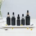 Black 5ml 10ml 15ml 20ml 30ml 50ml 100ml Glass Dropper Bottles for CBD Oil & Essential Oils - Dark Violet Glass with Pump