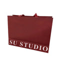Small Quantity Luxury Paper Bags Customized Red Gold Foil Recyclable With Colorful Plain Art and Ribbon Handle