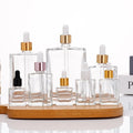 Wholesale Flat Essential Oil Bottle Skin Care Cosmetic Glass Dropper Bottle
