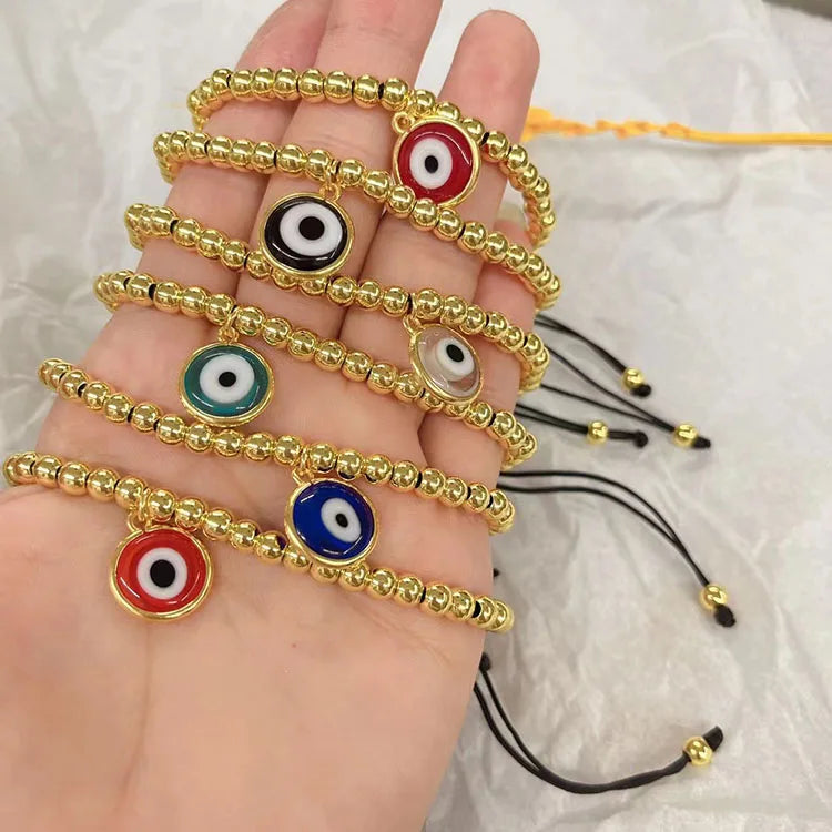 BM1123 18K Gold Plated Ball Beaded Macrame Bracelet with Hanging Glaze Evil Eyes Charm