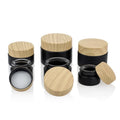 Custom logo Small Package 10g 15g 20g 30g 50g 60g Black Glass Jar with Wood Grain Cap for Cosmetic Facial Essence Cream