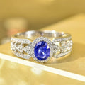 Huitan Wholesale OEM Trendy Oval Blue Crystal Cubic Zirconia Hollow Design Band Rings Women Wedding Gorgeous Silver Plated Rings