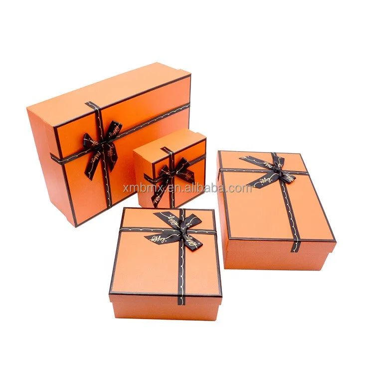 Factory Custom Luxury Orange Rigid Paper Cardboard Gift Packaging Rectangle Boxes with Ribbon Embossed Skincare Cosmetics Set