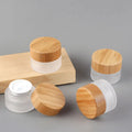 Luxury Guangdong 5g 15g 30g 50g 100g Frosted Clear Glass Cream Jar with Bamboo Lid for Eye Cream