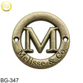Round Shape Hollow Tag Designs Antique Brass M Letters Embossing Metal Label Logos for Clothes
