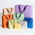 Wholesale Custom Designed Printed Paper Bags with Ribbon Handle for Clothing Shoes Underwear Featuring Your Own Logo