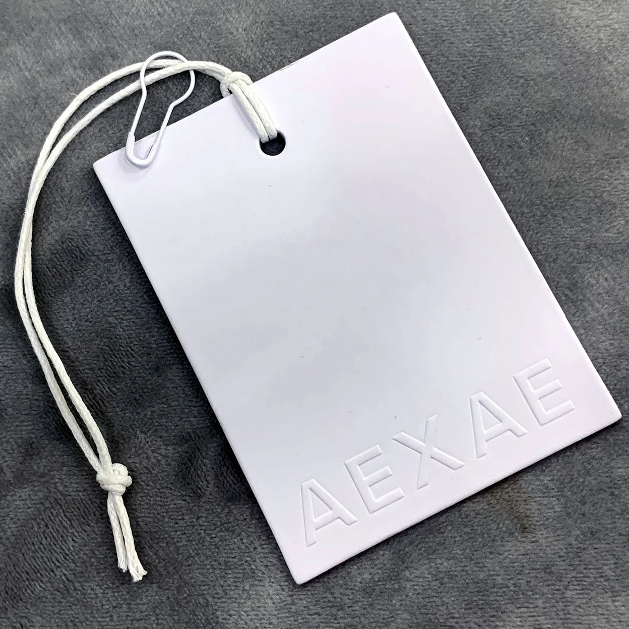 Wholesale Custom Luxury Embossed Tags White Special Paper Garment Labels Clothing Jeans Hang Tags for Clothes