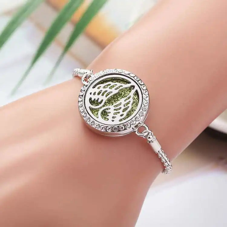 Wholesale OEM Essential Oil Perfume Diffuser Stainless Steel Faith Wing Aromatherapy Women Bracelet