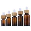 Hot Sale 20ml 30ml 50ml 100ml Dark Brown Amber Essential Oil Glass Container Bamboo Dropper Bottle for Cosmetic Packaging