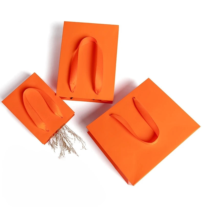 Small Orange Party Favor Goodie Bags with Ribbon Handle White Cardboard Paper for Promotions and Gifts