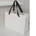 Wholesale Luxury Custom White Paper Bag Logo Printing Paperbag Shopping Gift Paper Bag With Ribbon Handle