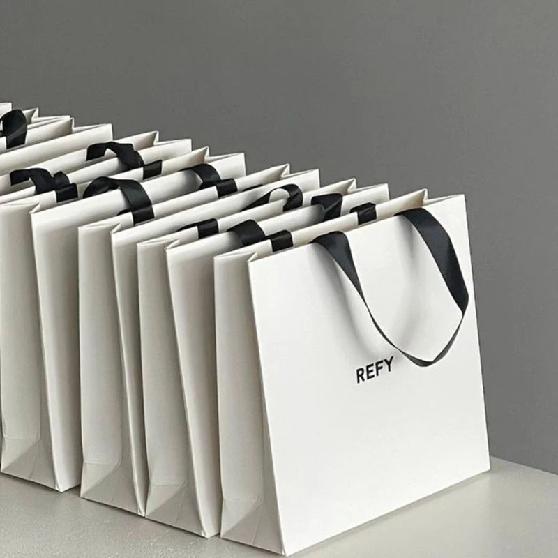 Custom Printed Paper Bags Cardboard Luxury White Kraft Paper Gift Bag With Ribbon Handle for Shopping Bag With Your Own Logo