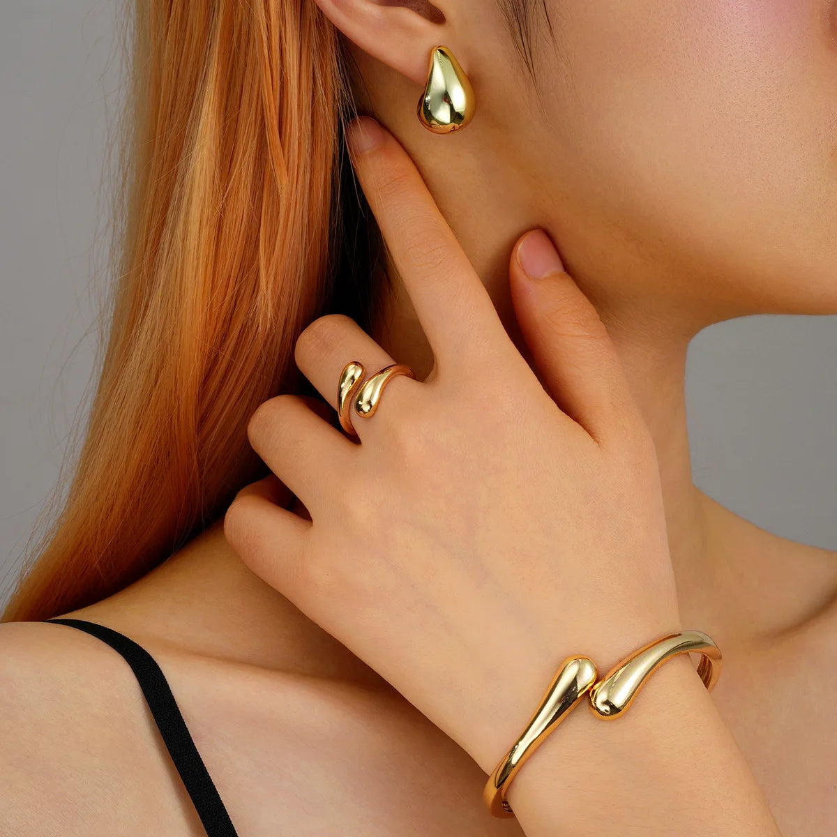 Fashion Women's Luxury Waterdrop Geometric Punk Jewelry Set Metal Smooth Spring Earrings Bracelet Ring Set