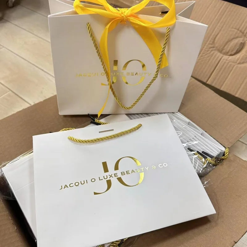 Wholesale White Kraft Paper Gift Bags with Gold Foil Embossed Laminated Customizable for Jewelry Clothing Glasses Packaging