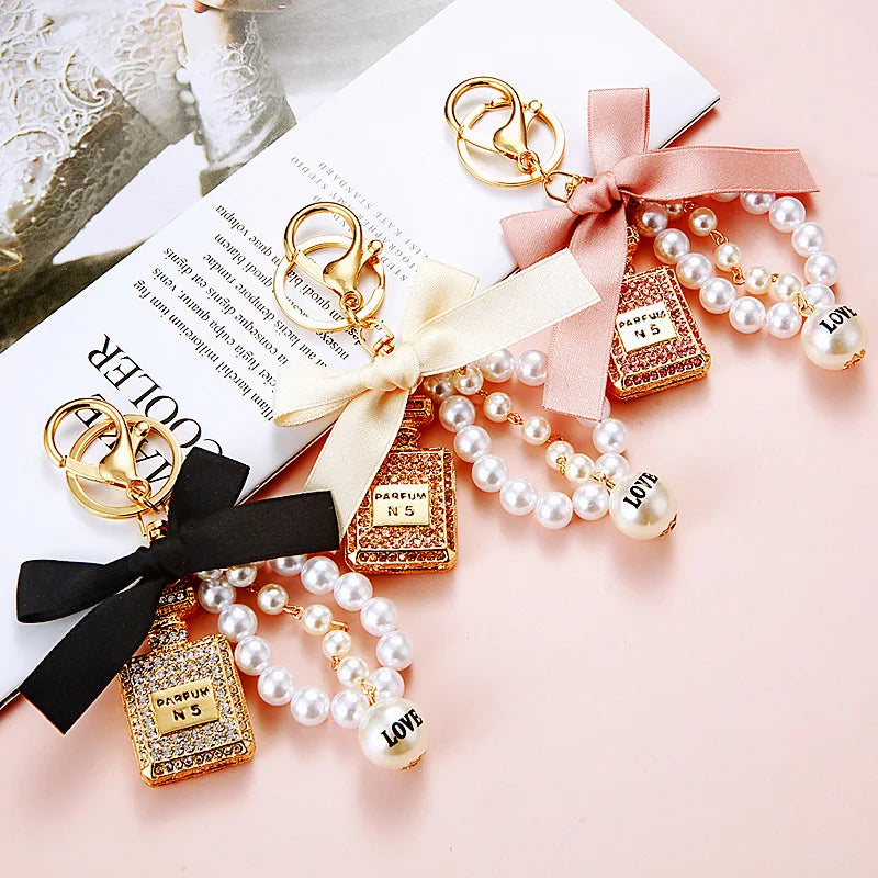 New Fashion Pearl Wristband Key Chain Personality Rhinestone Perfume Bottle Bow Keychain Cute Car Key Bag Pendant