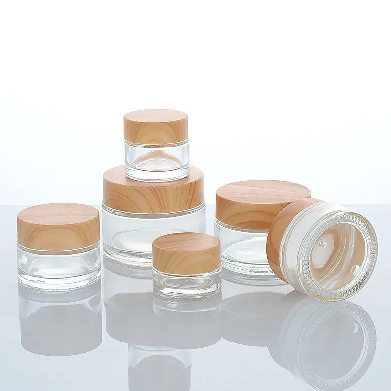 Hot Sale Cosmetic Round Face Cream Container 5ml 15ml 30ml 50ml 100ml Frosted clear Body Cream Glass Jar with Plastic Wood Lid