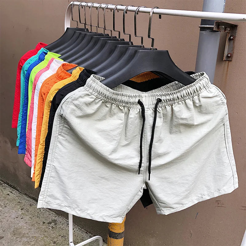 Wholesale Stock Beach Shorts Polyester Men Running Shorts Swimwear Shorts for Men Custom logo Embroidered and Tag