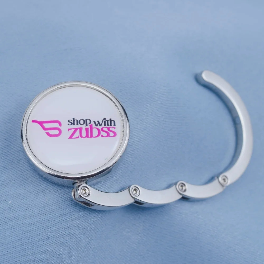 OEM Factory Custom Metal Magnetic Folding Purse Hanger / Bag Holder with "shop with Zubss" Epoxy Sticker Zinc Alloy Bag Hanger