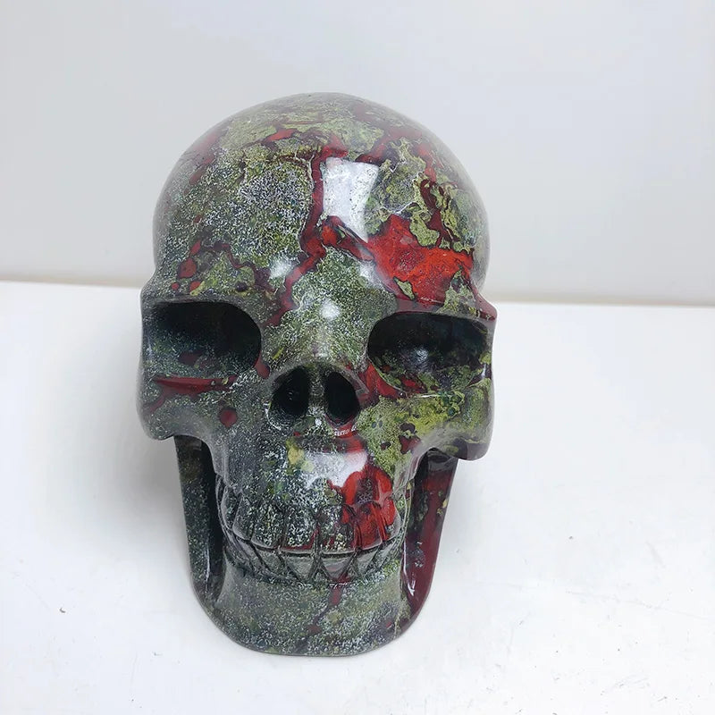 Wholesale Natural Hand Carved Realistic Crystal Skulls Dragon Blood Stone Skulls Carving Craft