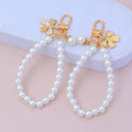 Fashion Rhinestone butterfly Keychain Cute Pearl Chain Key Chain Creativity Bow Pendant Earphone case Bag Car Key Accessories