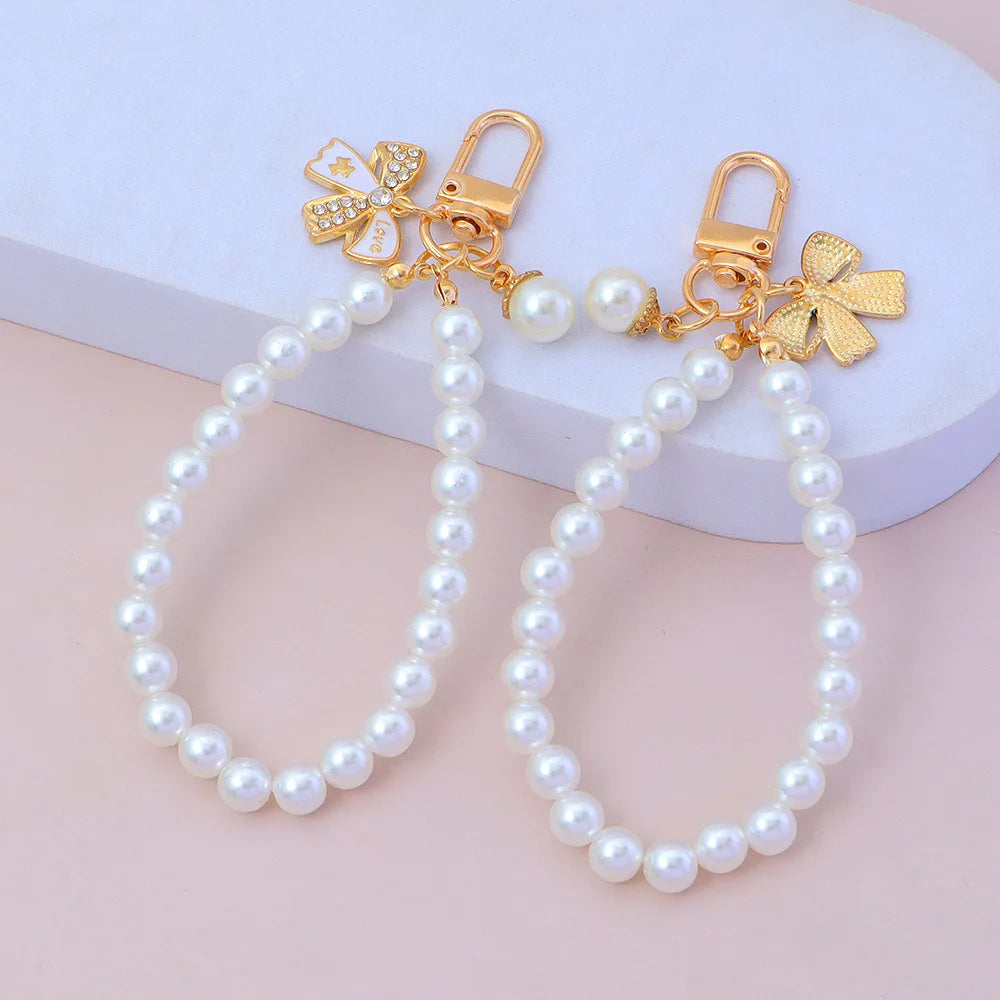 Fashion Rhinestone butterfly Keychain Cute Pearl Chain Key Chain Creativity Bow Pendant Earphone case Bag Car Key Accessories