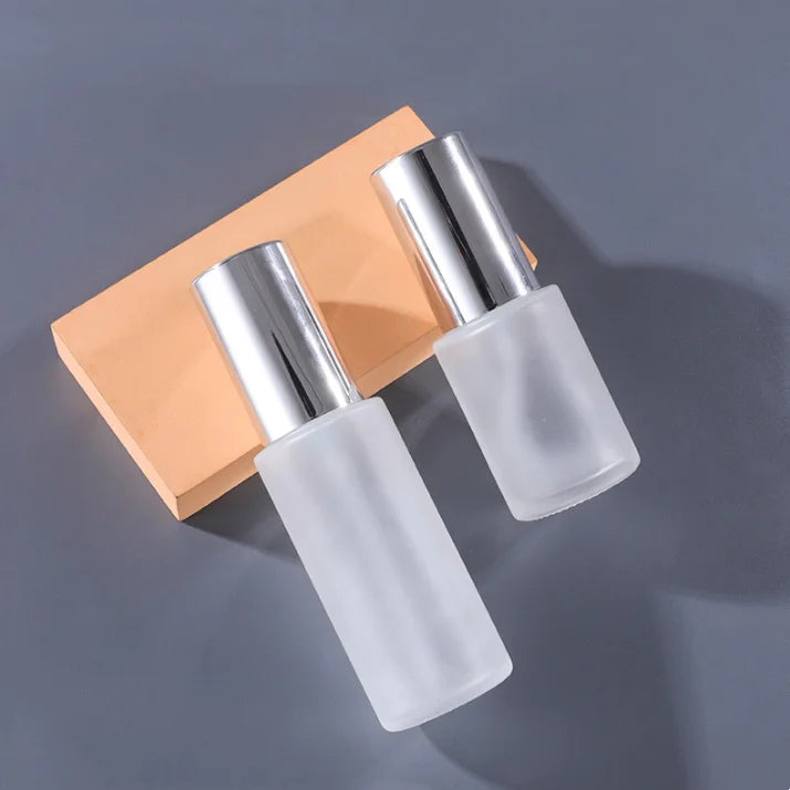 Beauty Skincare Cosmetic Packaging 20ml 30ml 60ml 100ml Shinning Silver Cover Frosted Flat Lotion Pump Glass Bottle