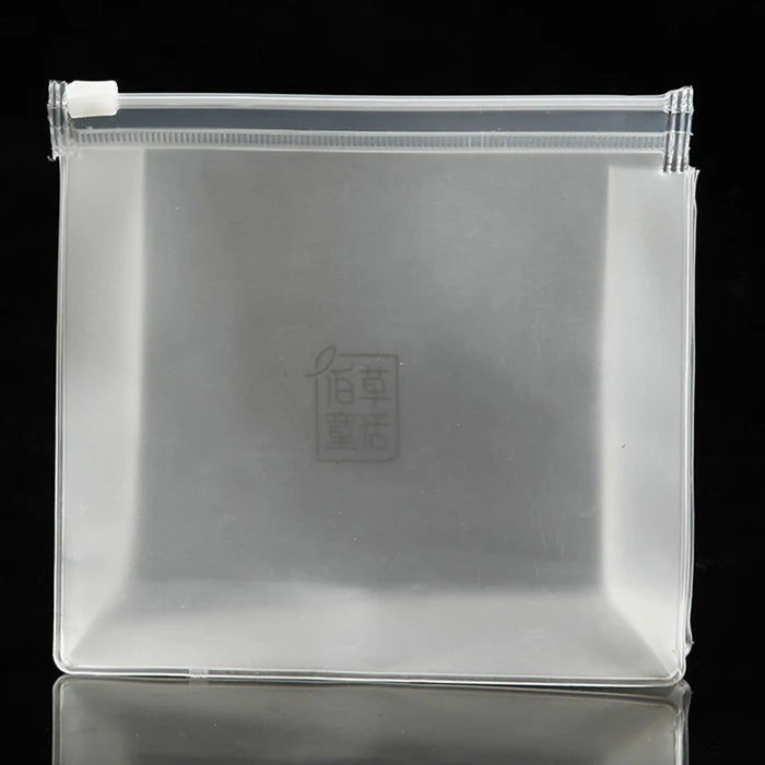 Wholesale Large PVC Cosmetic Bag Transparent Frosted Finish Zipper Closure Foldable Feature Letter Travel Toilet Packaging