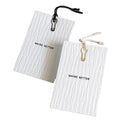 Wholesale Luxury White Garment Paper Hang Tag with Embossed Swing Logo Custom Logo Printed Clothing Labels for Bags