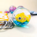 Acrylic Glitter Sequin Quicksand Waterfall Fish Floating Mini Snow Water Ball Globe Dome Liquid Oil Keychain